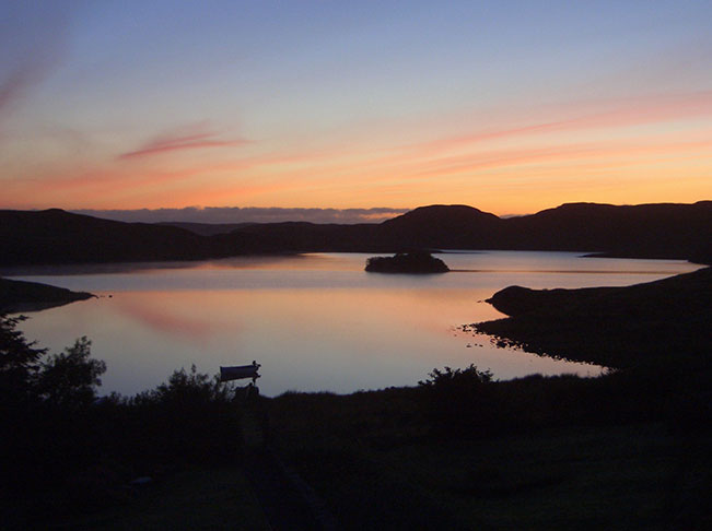 red sky, boat, calm loch